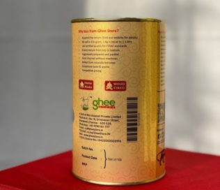 Back View Of A Cylindrical Container Of Ghee From &Quot;Ghee Store&Quot; With Product Details, Including Address, Website, Contact Information, And Benefits Like Assured Free Return, Lab-Certified Quality, And Competitive Pricing.