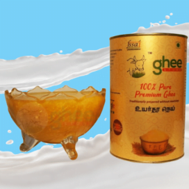 100% Pure Premium Ghee Container With A Glass Bowl Of Ghee On A Blue And White Background.