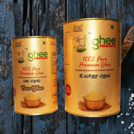 Two Tins Of Ghee Store'S 100% Pure Premium Ghee Placed Against A Dark Wooden Background.