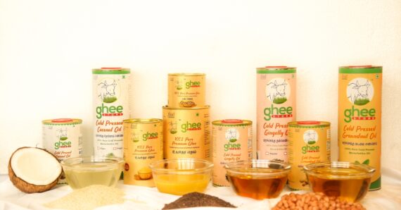 Shop Variety Of Ghee And Cold-Pressed Oil Products Displayed With Raw Ingredients.