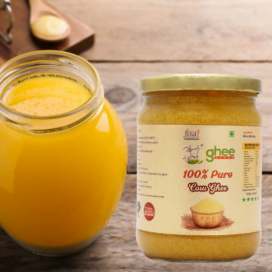 Jar Of 100% Pure A2 Desi Cow Ghee Made In Bilona Method Next To A Glass Container Filled With Ghee On A Wooden Surface.