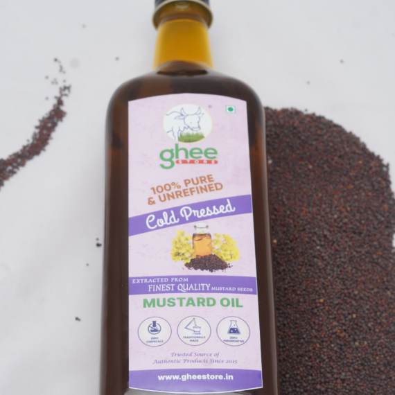 Bottle Of Gheestore 100% Pure And Unrefined Cold-Pressed Mustard Oil With Mustard Seeds In The Background.