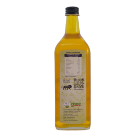 A Bottle Of Yellow Cooking Oil With A Black Cap, Displaying Nutritional Information, Ingredient List, Qr Code, And Branding On The Label.