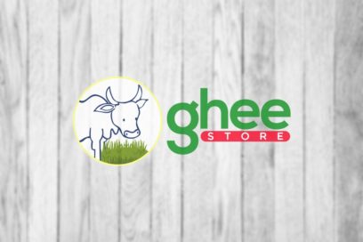 Logo With A Sketched Cow Inside A Yellow Circle, Next To The Text &Quot;Ghee Store&Quot; Against A Light Wood Background.